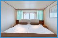An old Holland America cruise ship is turning residential, letting travelers live at sea for $8,000 a month while it circumnavigates the globe
